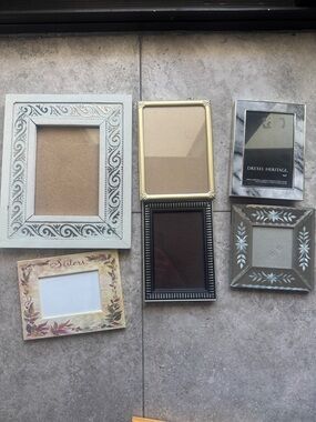 Lot of frames various sizes including a vintage looking mirrored frame.